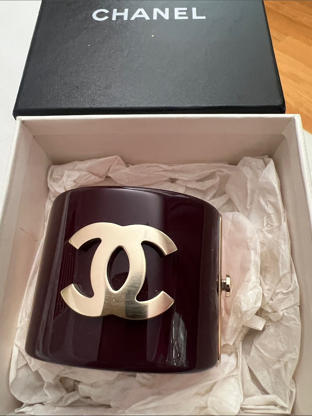 CHANEL Deep Burgundy Resin Cuff with Gold CC Emblem